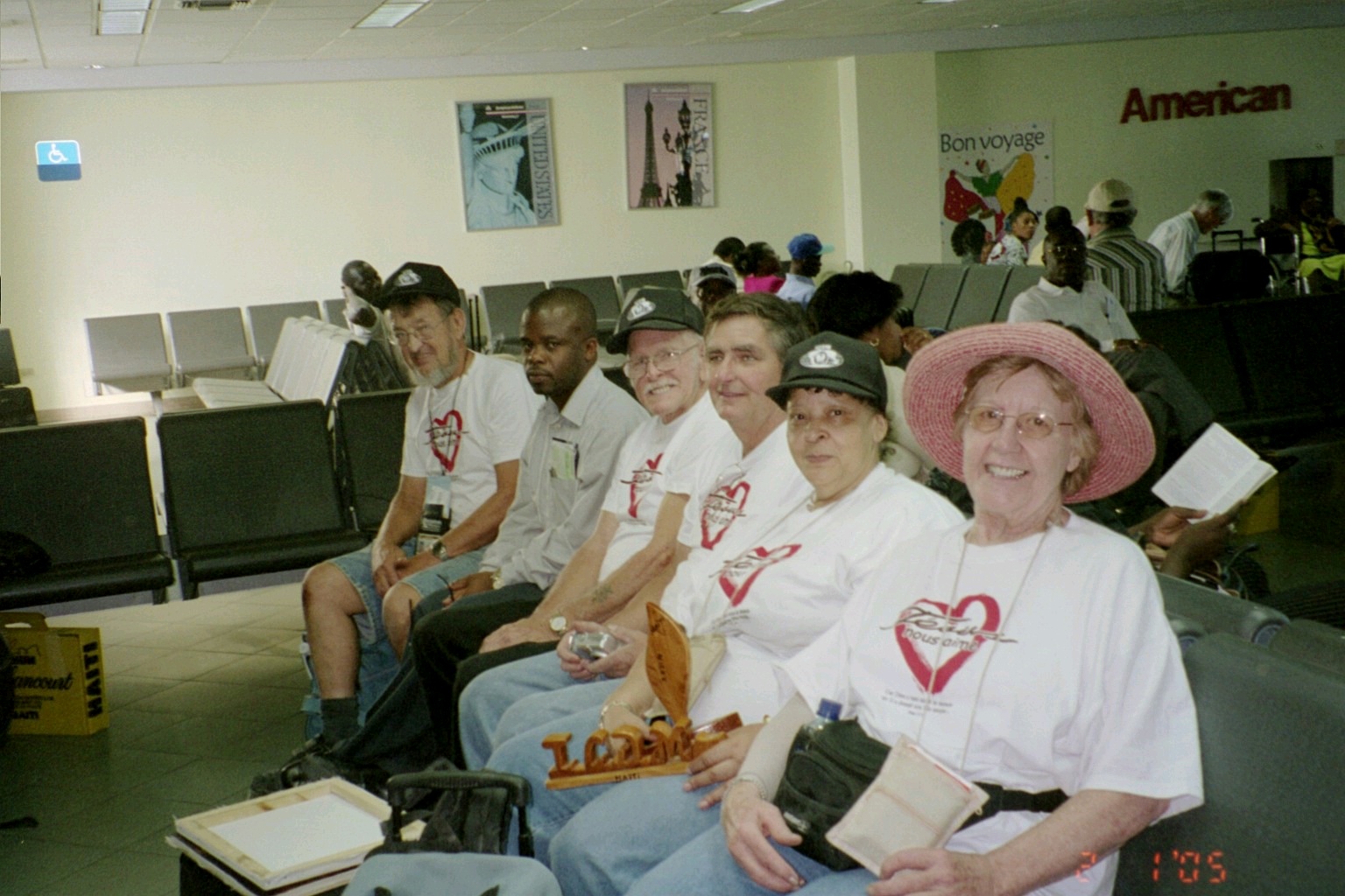 Shirley is the one with the pink hat.